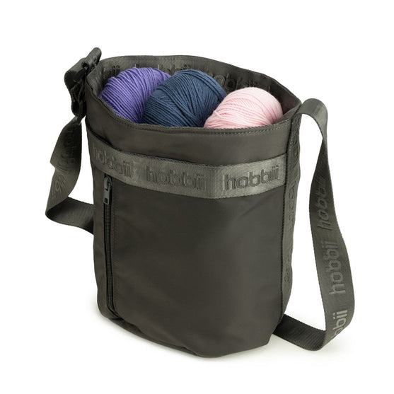 Cilinder schoudertas - Hobbii
2