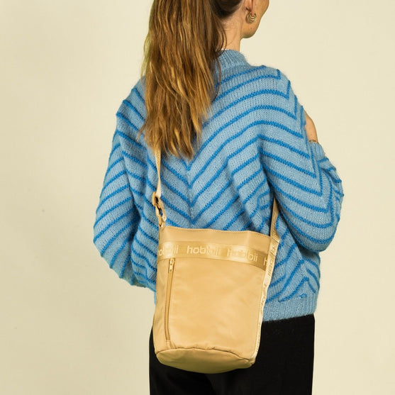 Cilinder schoudertas - Hobbii
4